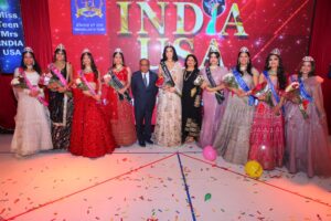 Dharmatma and Neelam Saran of Worldwide Pageants with Participants and Judges