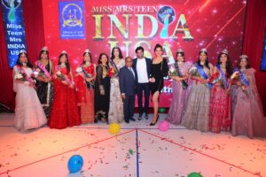Dharmatma and Neelam Saran of Worldwide Pageants with Participants and Judges